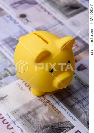 A piggy bank as a concept for storing, accumulating, and saving financial resources. A piggy bank A piggy bank as a concept for storing, accumulating, and saving financial resources. A piggy bank 142000087