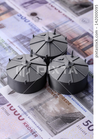 Liquefied gas storage tanks set against the Danish money as a background for your design Liquefied gas storage tanks set against the Danish money as a background for your design 142000095