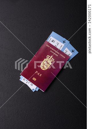 Denmark, Danish passport or id document with tickets for flight, travel. Danish passport Denmark, Danish passport or id document with tickets for flight, travel. Danish passport 142000171