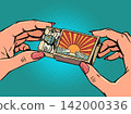 Women's hands hold a matchbox, inside it is a mustachioed robot. AI recommends purchases and trips. Artificial intelligence is everywhere. 142000336