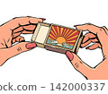 Women's hands holding a matchbox. Items for a hike, tourist explorer. Hot sale and discounts. 142000337