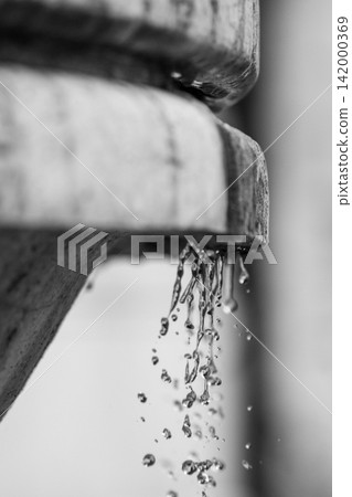 Black and white close-up of water dripping from fountain Black and white close-up of water dripping from fountain 142000369