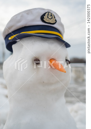 Snowman wearing captain hat in winter Snowman wearing captain hat in winter 142000375