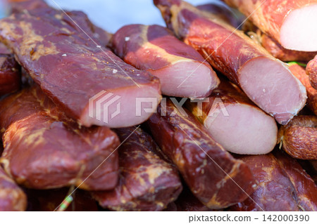 Close up of smoked cured meat pieces Close up of smoked cured meat pieces 142000390