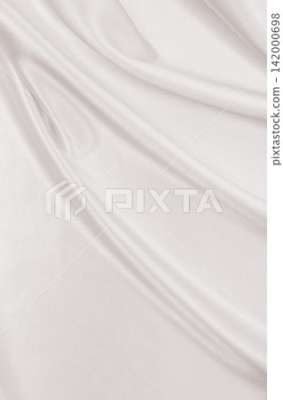 Smooth elegant golden silk or satin luxury cloth texture as wedding background. Luxurious background design. In Sepia toned. Retro style Smooth elegant golden silk or satin luxury cloth texture as wedding background. Luxurious background design. In Sepia toned. Retro style 142000698