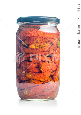 Jar Of Sun-Dried Tomatoes Preserved In Oil Close-Up On White Background Jar Of Sun-Dried Tomatoes Preserved In Oil Close-Up On White Background 142001195