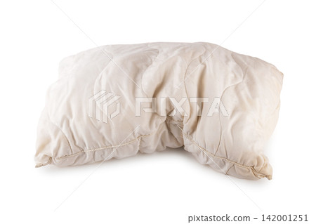 Old worn dirty pillow isolated on a white background. This stained used bedding highlights poor sleep hygiene and the need to replace it to avoid allergens and dust mites. Old worn dirty pillow isolated on a white background. This stained used bedding highlights poor sleep hygiene and the need to replace it to avoid allergens and dust mites. 142001251