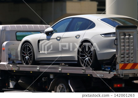 Image of a carrier car transporting a sports car Image of a carrier car transporting a sports car 142001263