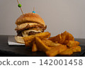 Gourmet Hamburger with Fried Egg, Melted Cheese and French Fries 142001458