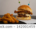 Double Cheeseburger with Fried Egg, Caramelized Onion and Fries 142001459