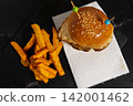 Hamburger with Fried Egg and Cheese Served with French Fries 142001462