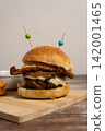 Juicy Hamburger with Egg, Cheese, Onions and French Fries 142001465