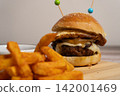 Juicy Gourmet Hamburger with Fried Egg, Cheese and French Fries 142001469
