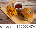 Delicious Double Burger with Fried Egg, Melted Cheese and Fries 142001470