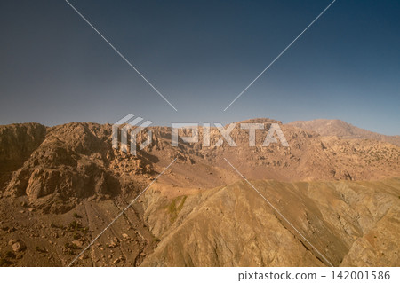 Barren Mountain Ridge Under a Clear Blue Sky Barren Mountain Ridge Under a Clear Blue Sky 142001586