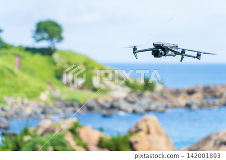 A drone flying over the coast of Aomori Prefecture. A drone flying over the coast of Aomori Prefecture. 142001893