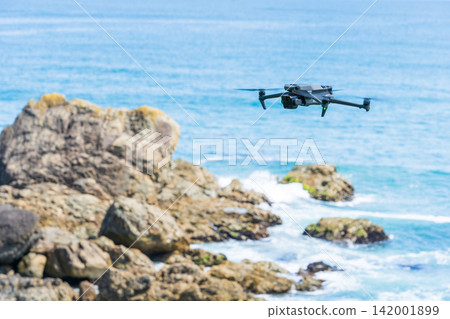 A drone flying over the coast of Aomori Prefecture. A drone flying over the coast of Aomori Prefecture. 142001899