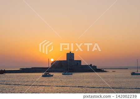 Colombia Castle and yachts in Trapani, Sicily, bathed in the setting sun. Colombia Castle and yachts in Trapani, Sicily, bathed in the setting sun. 142002239