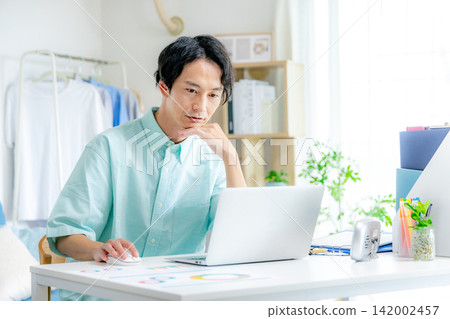 A young man doing telework A young man doing telework 142002457