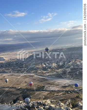 Cappadocia's unique rock formations and hot air balloons seen from above 3_Turkey_Cappadocia_ Göreme Cappadocia's unique rock formations and hot air balloons seen from above 3_Turkey_Cappadocia_ Göreme 142004036