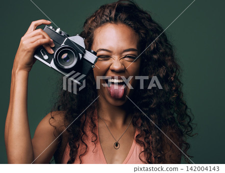 Woman, camera and excited with photography in studio on green background for fun, art and creativity. Photographer, fashion and lenses for memories as hobby with smile, happiness and funny as artist Woman, camera and excited with photography in studio on green background for fun, art and creativity. Photographer, fashion and lenses for memories as hobby with smile, happiness and funny as artist 142004143