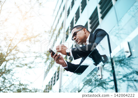 Portrait, executive and phone, outdoor and balcony of company, corporate and mature person. Businessman, employee and serious for deal or project, mobile and communication, suit and texting for job Portrait, executive and phone, outdoor and balcony of company, corporate and mature person. Businessman, employee and serious for deal or project, mobile and communication, suit and texting for job 142004222