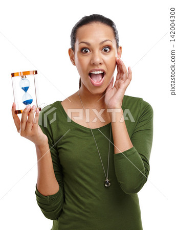 Portrait, woman and time with sand glass with surprised gesture or timer in studio. Shocked, person and hands on face for countdown of business deadline with hourglass minute on white background Portrait, woman and time with sand glass with surprised gesture or timer in studio. Shocked, person and hands on face for countdown of business deadline with hourglass minute on white background 142004300