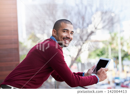 Balcony, portrait and man with tablet reading website review, online report or article for business opportunity. Networking, communication and businessman with digital app checking email at office Balcony, portrait and man with tablet reading website review, online report or article for business opportunity. Networking, communication and businessman with digital app checking email at office 142004413