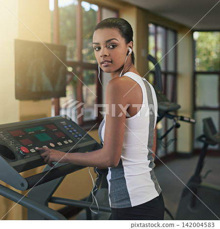 Black woman, gym and treadmill for fitness with looking away, exercise and workout routine for health. Female person, thoughts and contemplation with commitment for wellness, wellbeing and self care Black woman, gym and treadmill for fitness with looking away, exercise and workout routine for health. Female person, thoughts and contemplation with commitment for wellness, wellbeing and self care 142004583
