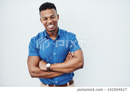Portrait, business and man with arms crossed, smile and confident guy on white studio background. African person, model or agent with professional, creativity and pride for startup or career ambition Portrait, business and man with arms crossed, smile and confident guy on white studio background. African person, model or agent with professional, creativity and pride for startup or career ambition 142004627