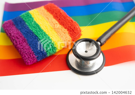 Stethoscope on LGBT rainbow flag, rights and gender equality. Stethoscope on LGBT rainbow flag, rights and gender equality. 142004632