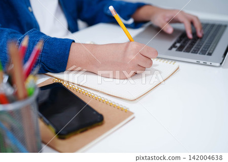 Teenage using smart phone for communication, search data internet website to learn. Teenage using smart phone for communication, search data internet website to learn. 142004638