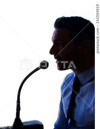 Businessman, silhouette and talking with mic for speech, presentation or discussion on a white studio background. Man, politician or business spokesperson in conversation, speaker or desk microphone Businessman, silhouette and talking with mic for speech, presentation or discussion on a white studio background. Man, politician or business spokesperson in conversation, speaker or desk microphone 142004919