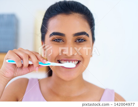 Portrait, woman and toothbrush for brushing teeth in bathroom, dental health and wellness with routine at home. Oral hygiene, orthodontics and fresh breath with morning self care and tooth whitening Portrait, woman and toothbrush for brushing teeth in bathroom, dental health and wellness with routine at home. Oral hygiene, orthodontics and fresh breath with morning self care and tooth whitening 142004977