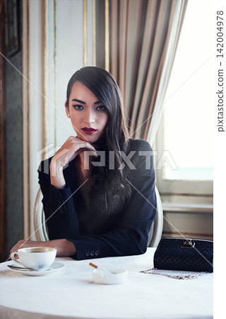 Portrait coffee and woman with cigarette, restaurant and luxury with break, mob wife and boss lady. Face, person or vintage fashion with girl in cafe, rich or wealthy with confident gangster or hotel Portrait coffee and woman with cigarette, restaurant and luxury with break, mob wife and boss lady. Face, person or vintage fashion with girl in cafe, rich or wealthy with confident gangster or hotel 142004978