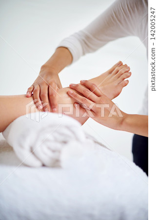 Foot, hands and masseuse with massage at spa for treatment, beauty and skincare at luxury resort with wellness. Pedicure, cosmetics and people for physical therapy, healing for self care and relief Foot, hands and masseuse with massage at spa for treatment, beauty and skincare at luxury resort with wellness. Pedicure, cosmetics and people for physical therapy, healing for self care and relief 142005247