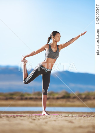 Outdoor, yoga and girl stretching with balance in countryside for calm exercise in nature of desert. Fitness, training and flexible woman in workout for health, wellness or zen in summer environment Outdoor, yoga and girl stretching with balance in countryside for calm exercise in nature of desert. Fitness, training and flexible woman in workout for health, wellness or zen in summer environment 142005547