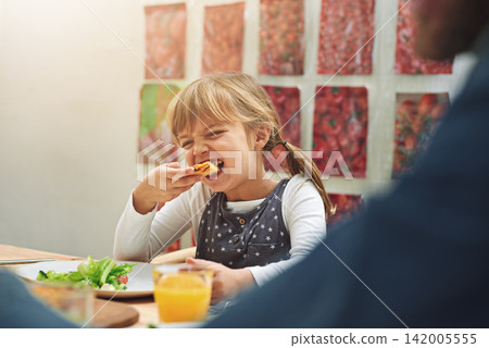 Happy, family and eating pizza at dinner table for conversation, affection and love at home. Young girl and parents with fast food or take away for easy meal at night with communication and support Happy, family and eating pizza at dinner table for conversation, affection and love at home. Young girl and parents with fast food or take away for easy meal at night with communication and support 142005555