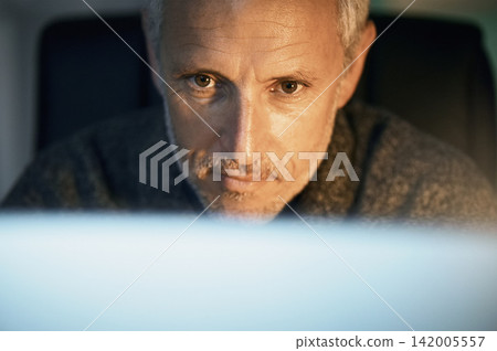 Night, research and mature man with computer reading website review, online report or article for business opportunity. Networking, communication and businessman at desk checking email in dark office Night, research and mature man with computer reading website review, online report or article for business opportunity. Networking, communication and businessman at desk checking email in dark office 142005557