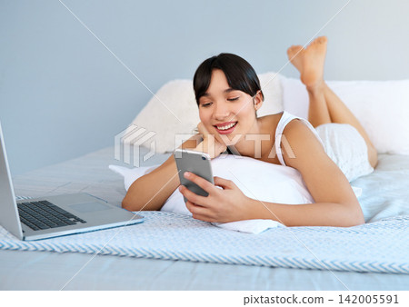Woman, bed or phone to relax, laptop or social media by thinking, ebook or communication online. Happy, girl or search of idea, vision or planning of internet, post or update of news app on mockup Woman, bed or phone to relax, laptop or social media by thinking, ebook or communication online. Happy, girl or search of idea, vision or planning of internet, post or update of news app on mockup 142005591