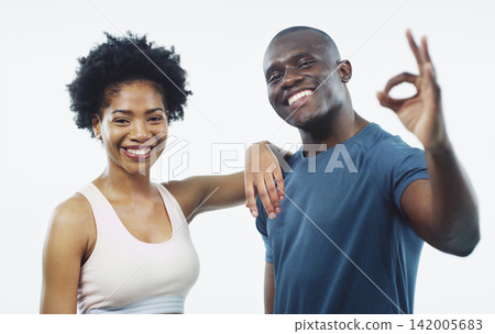 Black couple, portrait and fitness with ok sign for workout, training or exercise on a white studio background. Happy African man or woman with smile, like emoji or okay for health or body perfection Black couple, portrait and fitness with ok sign for workout, training or exercise on a white studio background. Happy African man or woman with smile, like emoji or okay for health or body perfection 142005683
