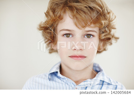 Wall background, young and portrait of child in home with serious expression, confidence and attitude. Fashion, style and face of young boy in trendy clothes, stylish and casual outfit on weekend Wall background, young and portrait of child in home with serious expression, confidence and attitude. Fashion, style and face of young boy in trendy clothes, stylish and casual outfit on weekend 142005684
