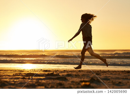 Happy, woman and running at beach for sunset, journey and freedom vacation in nature for mockup. Energy, fitness and wellness in Bali for holiday, adventure and ocean in summer on tropical island. Happy, woman and running at beach for sunset, journey and freedom vacation in nature for mockup. Energy, fitness and wellness in Bali for holiday, adventure and ocean in summer on tropical island. 142005690
