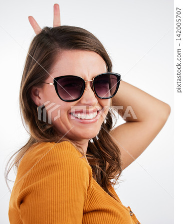 Peace sign, sunglasses and smile portrait with woman and happy with emoji, excited and hand gesture in studio. University student and modern fashion with clothes and confidence with white background Peace sign, sunglasses and smile portrait with woman and happy with emoji, excited and hand gesture in studio. University student and modern fashion with clothes and confidence with white background 142005707