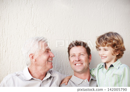 Hug, father and grandfather or son with smile for bonding, love or relax with generations by wall. Happy family, men or boy child in home for support, mockup space or embrace with confidence or pride Hug, father and grandfather or son with smile for bonding, love or relax with generations by wall. Happy family, men or boy child in home for support, mockup space or embrace with confidence or pride 142005790
