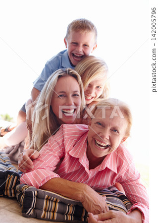 Portrait, family or smile on floor to relax on holiday as care, support or love in fun getaway. Grandma, mama or children to laugh, play or memory of motherhood, childhood or bonding together Portrait, family or smile on floor to relax on holiday as care, support or love in fun getaway. Grandma, mama or children to laugh, play or memory of motherhood, childhood or bonding together 142005796