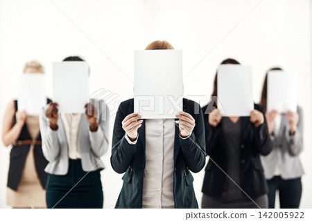Businesswoman, staff and holding message on board in studio for anonymous interview of career. Professional, group and female people with blank paper hiding face for marketing as brand ambassador Businesswoman, staff and holding message on board in studio for anonymous interview of career. Professional, group and female people with blank paper hiding face for marketing as brand ambassador 142005922