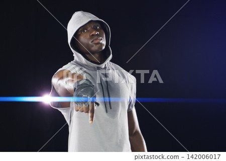 Black man, portrait and pointing finger as sports athlete on dark background, training or confidence. Male person, face and boxing fighter with mockup space in studio for gym exercise, health or fit Black man, portrait and pointing finger as sports athlete on dark background, training or confidence. Male person, face and boxing fighter with mockup space in studio for gym exercise, health or fit 142006017