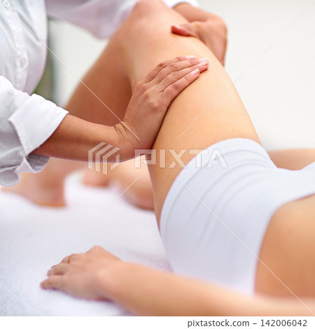Woman, spa and leg massage for physiotherapy, health and physical therapy for wellbeing break. Lady, detox and muscle treatment for body care, stress relief and zen for peaceful beauty or skincare Woman, spa and leg massage for physiotherapy, health and physical therapy for wellbeing break. Lady, detox and muscle treatment for body care, stress relief and zen for peaceful beauty or skincare 142006042