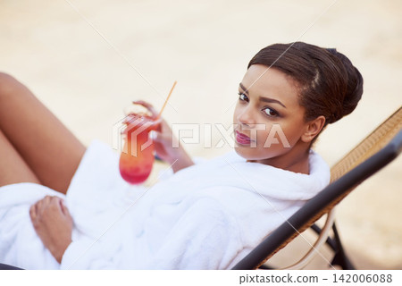 Woman, portrait and bathrobe with cocktail at spa accommodation or resort relax, vacation or hospitality. Female person, face and drinking alcohol at Bali lodge with pamper, calm or stress relief Woman, portrait and bathrobe with cocktail at spa accommodation or resort relax, vacation or hospitality. Female person, face and drinking alcohol at Bali lodge with pamper, calm or stress relief 142006088